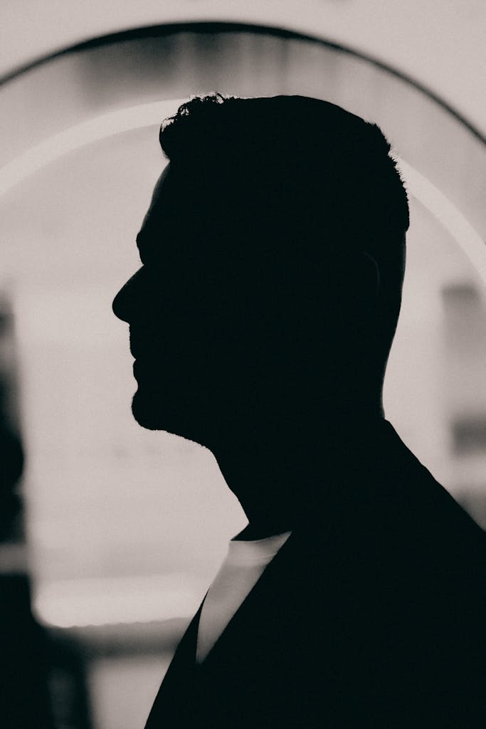 Elegant silhouette portrait of a man in profile view with monochrome artistry.